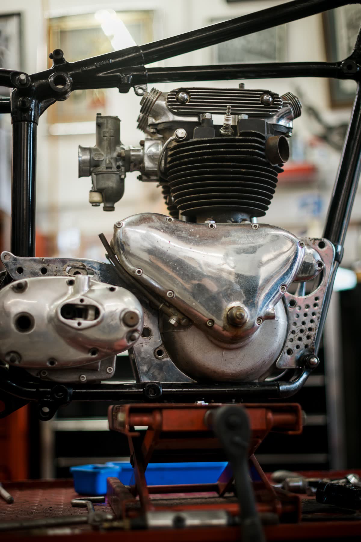 Vintage Triumph parallel twin engine sitting in its frame at Le Hangar 23