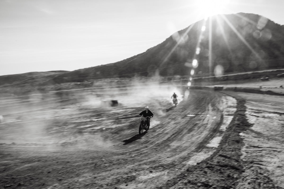 Rider on a vintage Triumph in the open desert