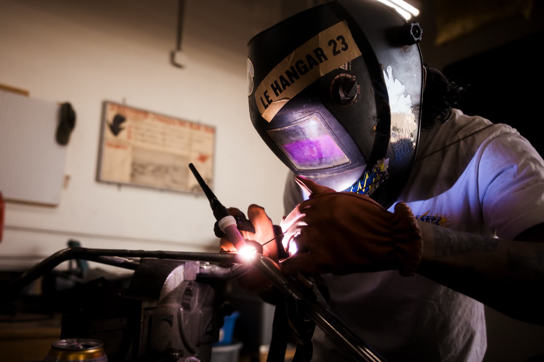 Welder at work on a Triumph frame in the LH23 shop