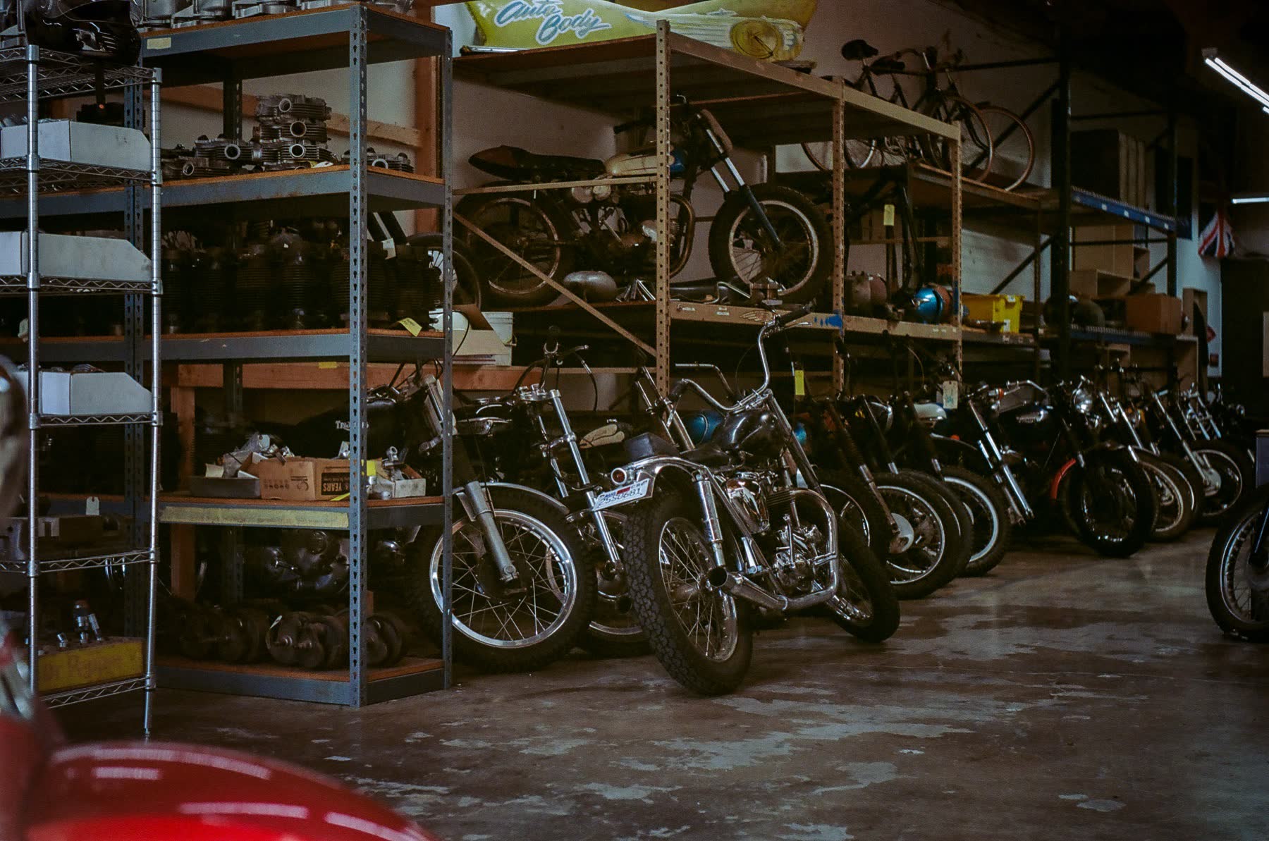 Wall of vintage Triumphs racked at Le Hangar 23